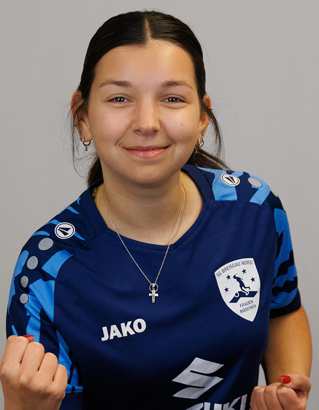 Eine der Spielerinnen im dunkelblauen Trikot rechte Hand zur Faust geballt